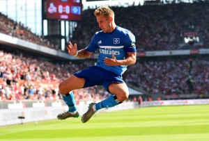 COLOGNE, GERMANY - AUGUST 29: Lewis Holtby of Hamburg celebrates after he scores the opening goal during the Bundesliga match between 1. FC Koeln and Hamburger SV at RheinEnergieStadion on August 29, 2015 in Cologne, Germany.  (Photo by Lars Baron/Bongarts/Getty Images)